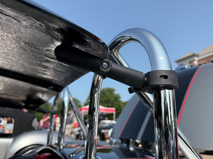 Top back attachment to the roll bar. 