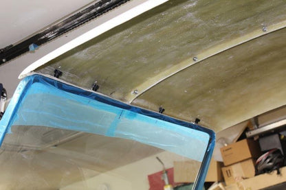 Top front attachment to the windshield frame. 
